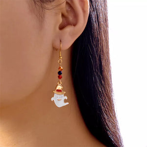gold earrings featuring dangle and novelty