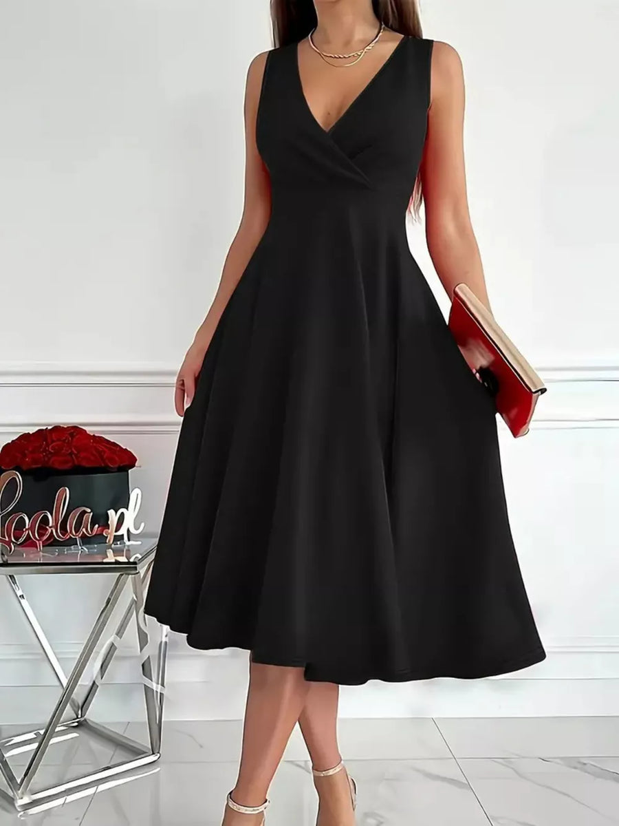 Black sleeveless midi dress with V-neck and flared skirt, styled with a clutch.