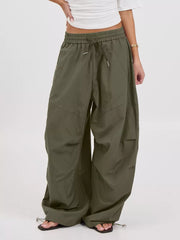 wide-leg pants in olive featuring drawstring waist and loose fit