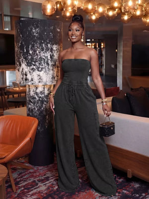 Black strapless jumpsuit with wide-leg pants and drawstring waist