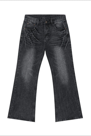 Washed black wide-leg denim jeans with distressed detailing and a bootcut flare.