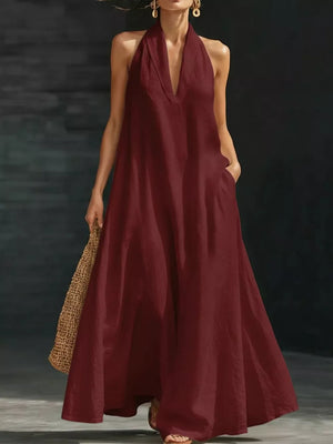 Burgundy halter neck maxi dress with pockets, 100% polyester, V-neck, flowy skirt.