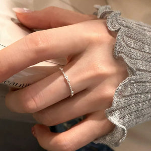 Delicate sterling silver ring with a dainty bow design.
