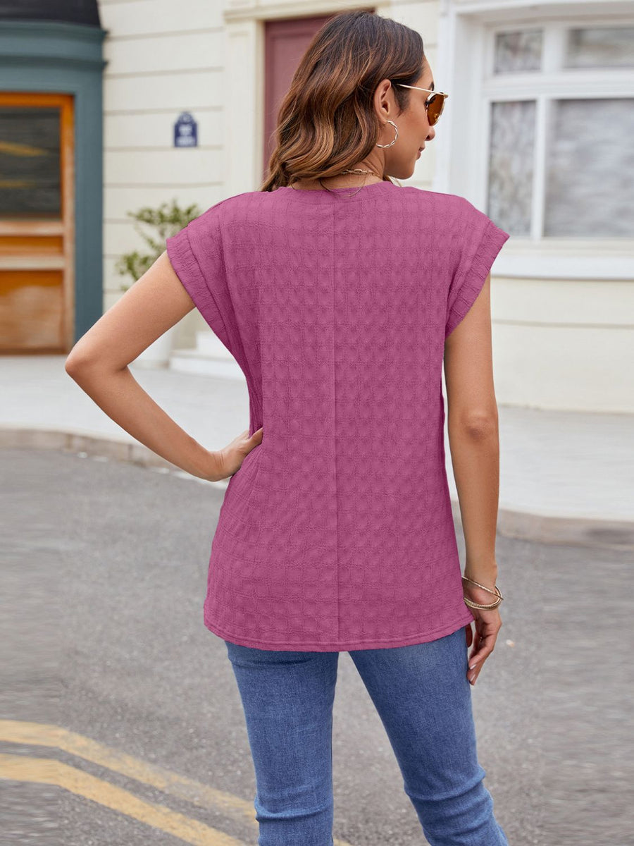 Textured cap-sleeve tee in Fuchsia with subtle knit pattern.