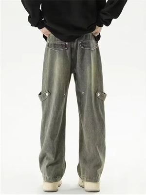 Vintage-inspired wide-leg cargo jeans in faded grey denim with button-flap side pockets.