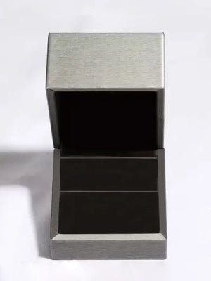 Open jewelry box with grey exterior and dark interior.