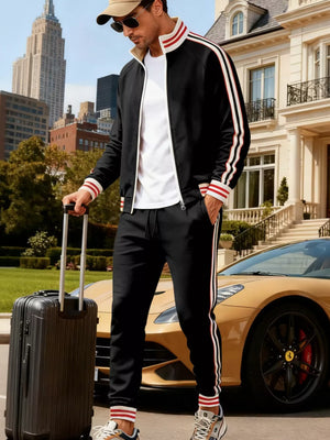 Black tracksuit with red and white stripes on sleeves and legs.