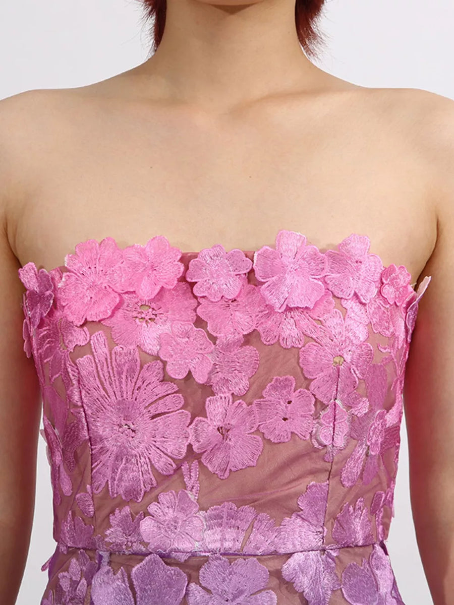 Strapless dress with pink floral embroidery on sheer fabric, ombre effect from pink to purple.