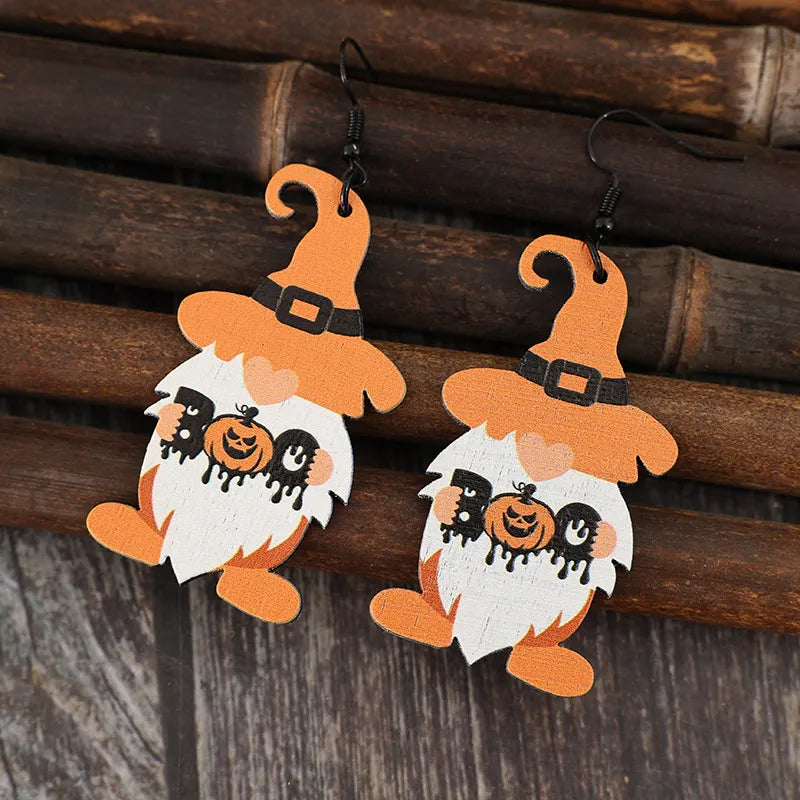 Boo Gnome Halloween earrings in tangerine orange with black accents and pumpkin detail.