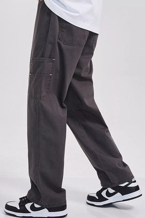 Relaxed fit dark gray cargo sweatpants with utility pockets and a casual cut.