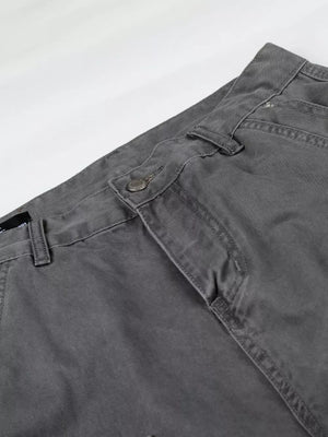 Relaxed fit grey cotton cargo capris with button closure and visible stitching details.