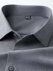 Refined slim fit dark gray long sleeve men's button-down undershirt detail.