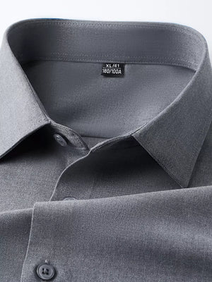 Refined slim fit dark gray long sleeve men's button-down undershirt detail.