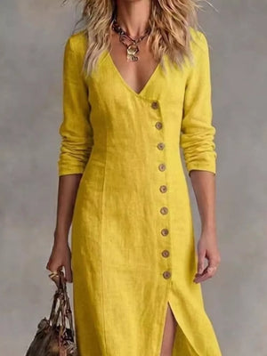 Yellow V-neck buttoned maxi dress with a side slit and long sleeves.