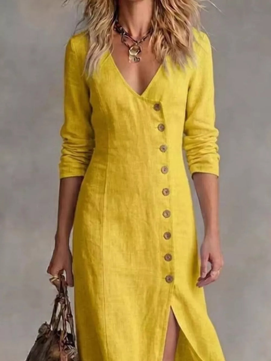 Yellow V-neck buttoned maxi dress with a side slit and long sleeves.