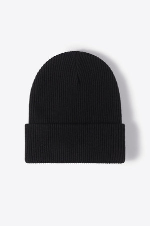 Black ribbed knit beanie with a cuffed hem