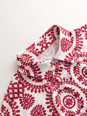 Deep Red printed tie-waist romper with button front and collar detail