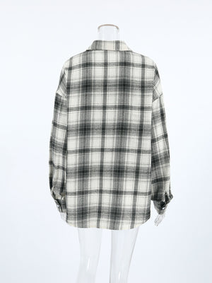 Button-up long sleeve shirt in black and white plaid cotton, shown from the back.