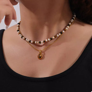 necklace in gold featuring layered and layered fit