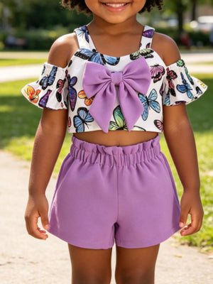 Baby set with butterfly print crop top, cold shoulder sleeves, and purple bow, paired with ruffled waist shorts.