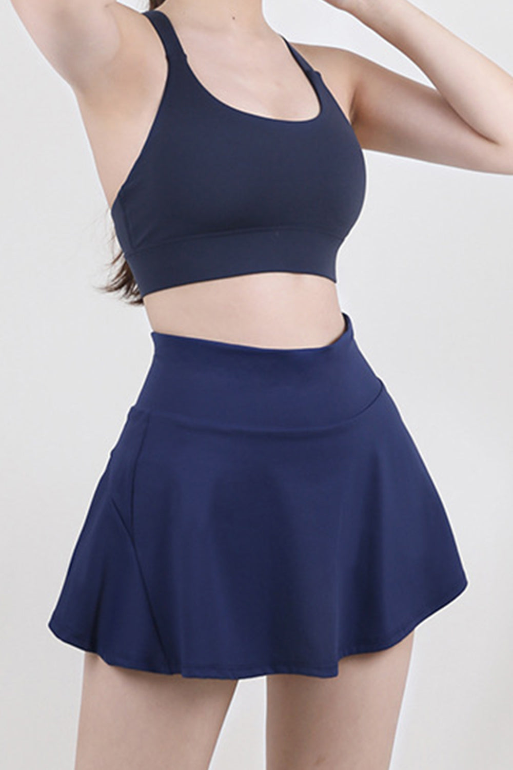 Dark Blue sculpted flared active skort with a high waist