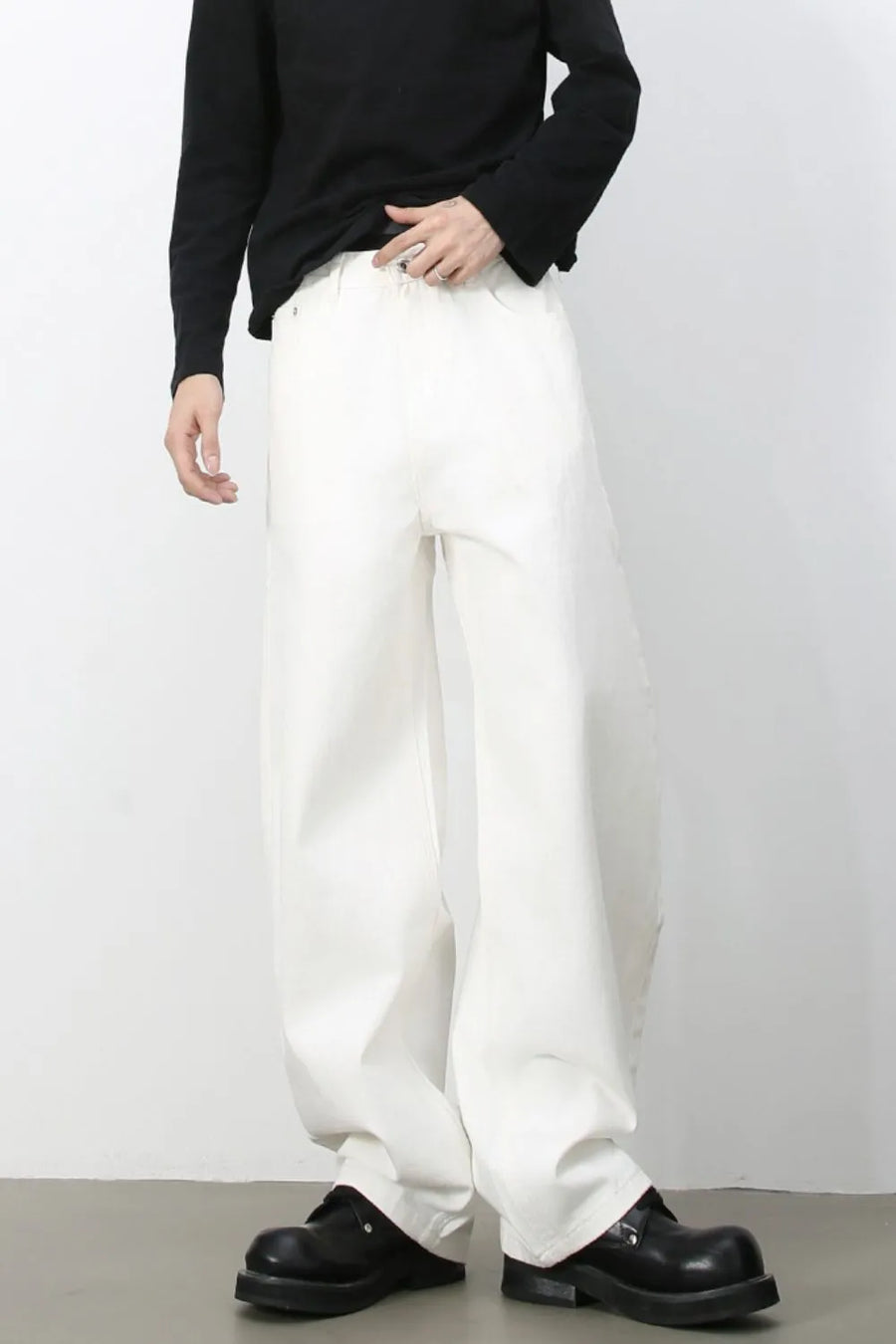 Sculpted ivory denim balloon trousers with a relaxed fit and wide leg.
