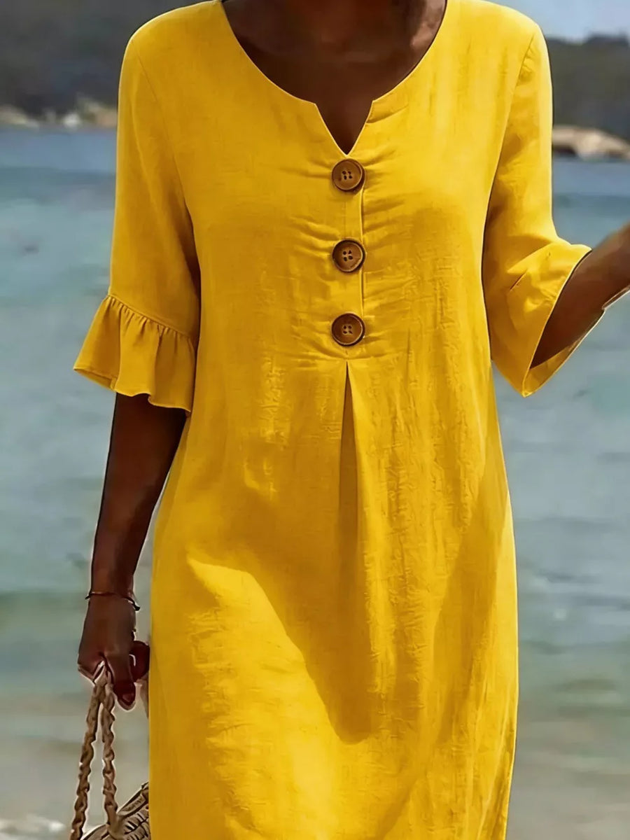 Yellow casual dress with ruffled sleeves and button detail.