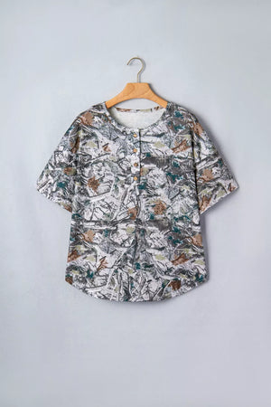 Earthy camouflage print henley t-shirt with short sleeves and buttoned placket.