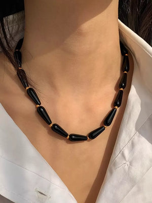 Elegant black teardrop agate choker necklace with gold accents