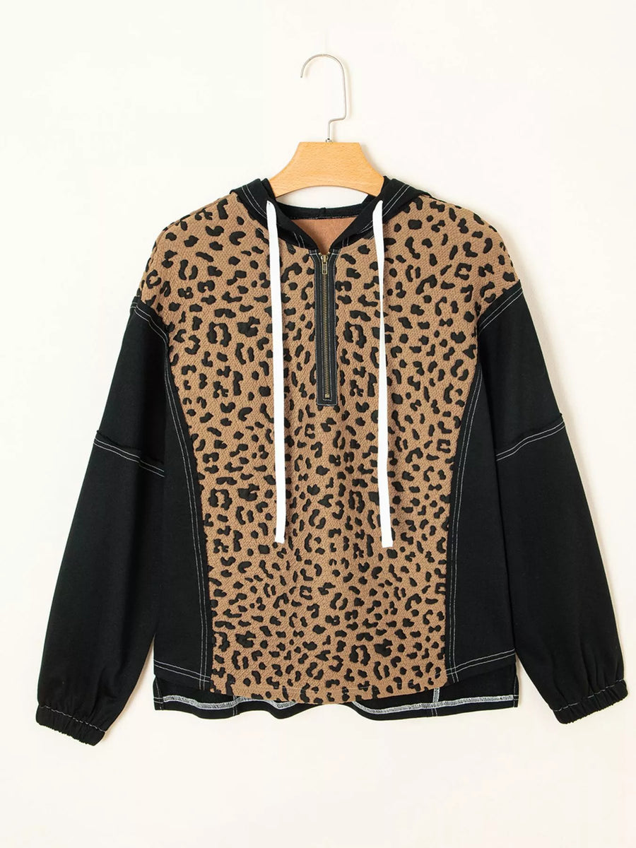 Leopard print zip hoodie with black sleeves and white drawstrings.