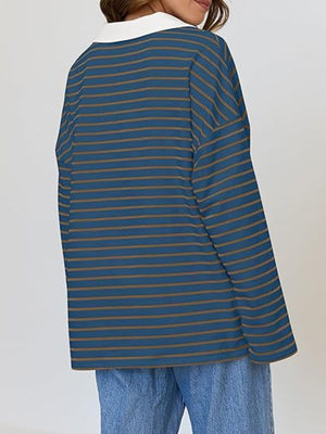 Oversized blue striped long-sleeve sweatshirt with white collar.