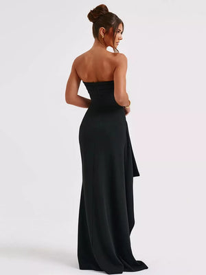 Black strapless maxi dress with ruching detail and high slit.