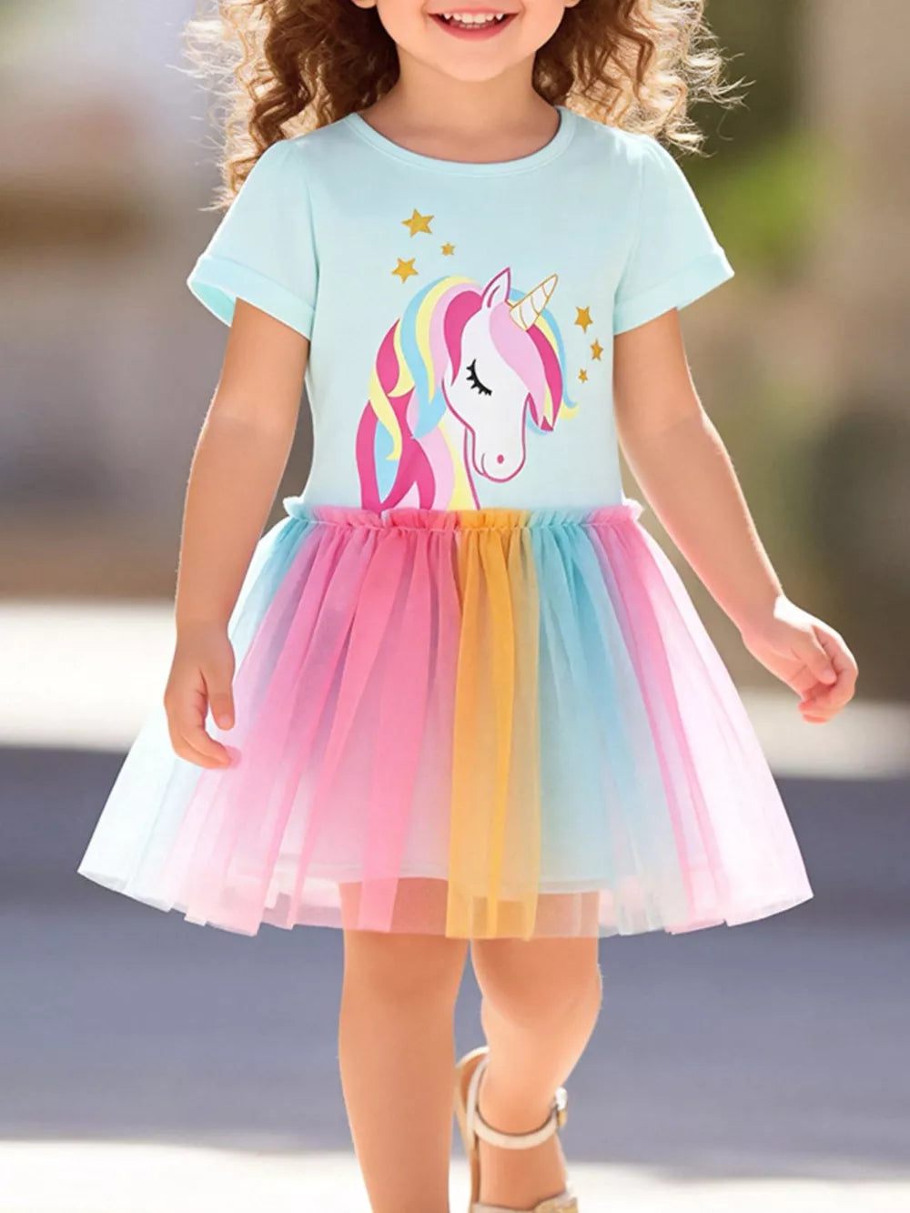 Unicorn Dreams Tulle Dress for toddlers with rainbow skirt and unicorn graphic.