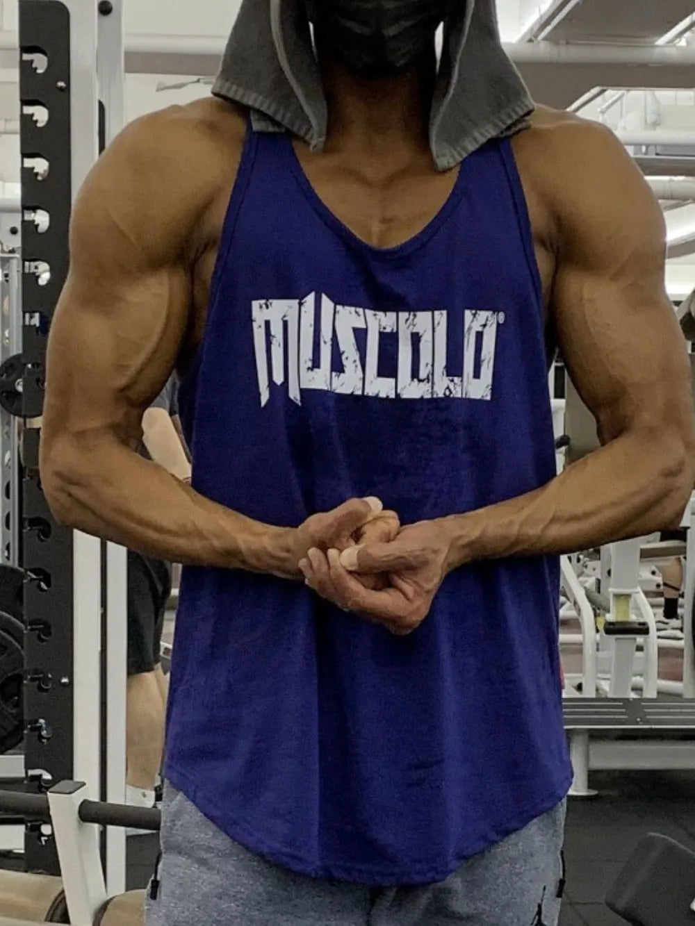 Navy muscle tank with distressed white logo graphic.