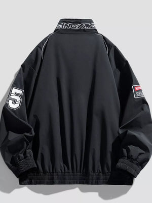 Black bomber jacket with white piping, number 5 graphic, and embroidered patches.