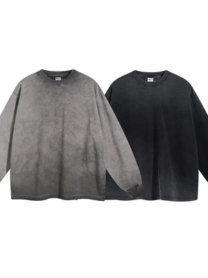 Vintage wash oversized crewneck sweatshirts in gray and black with distressed details.