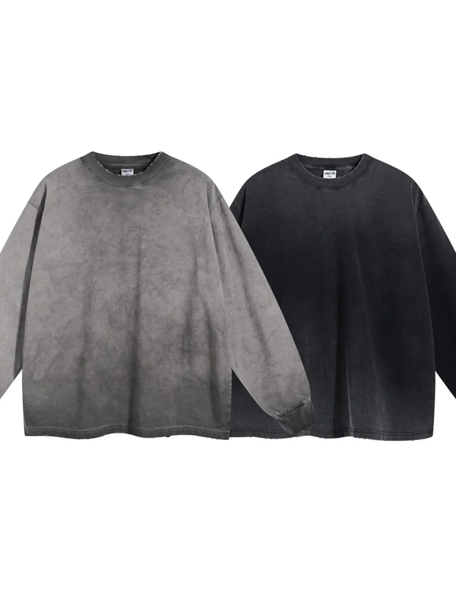Vintage wash oversized crewneck sweatshirts in gray and black with distressed details.