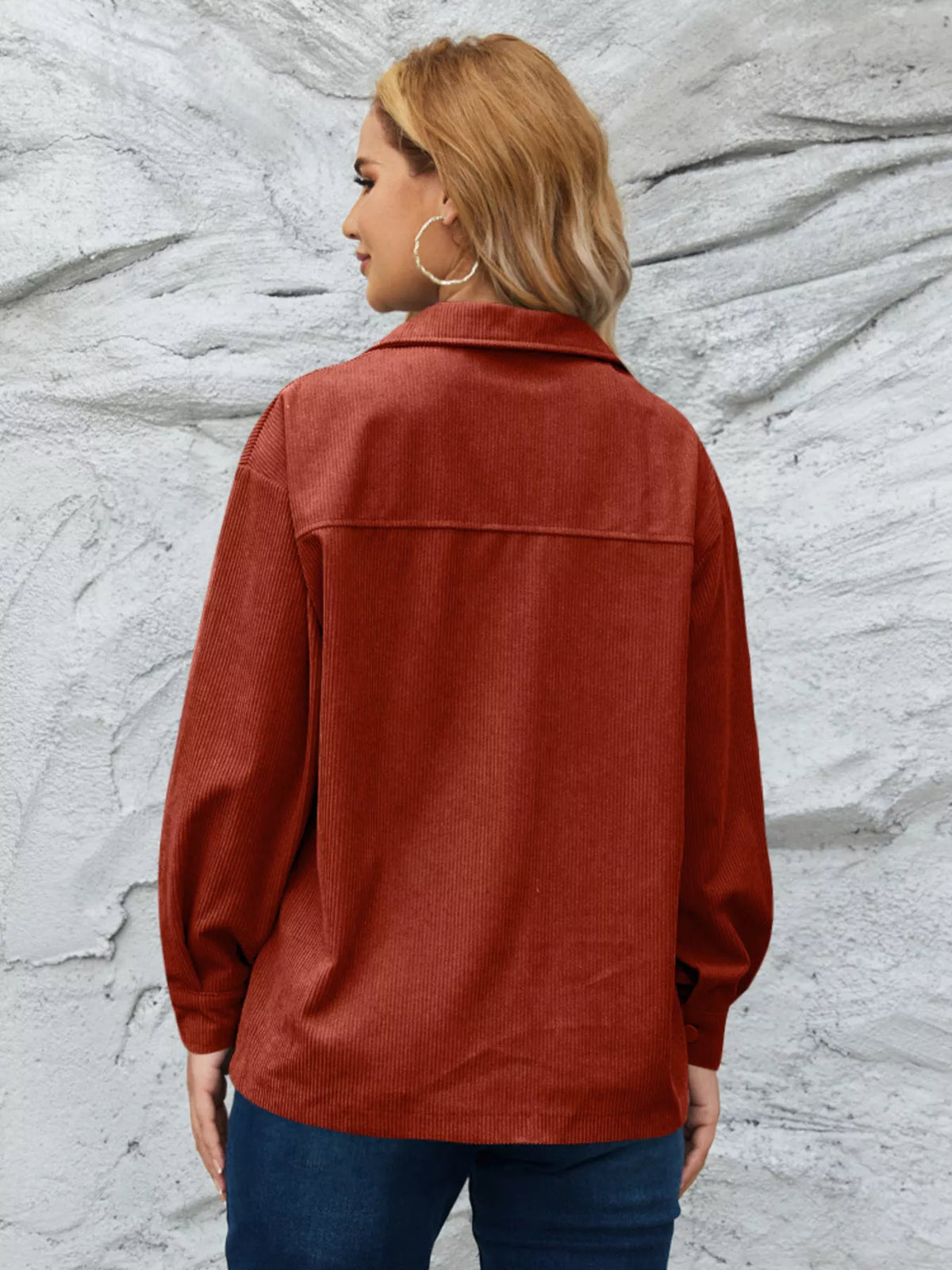 Textured corduroy button-up jacket in amber with a collared neckline and long sleeves.