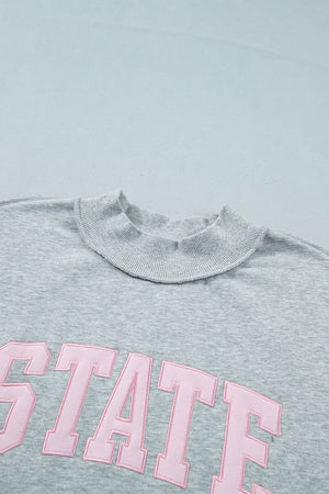 sweatshirt featuring graphic-print in light pink with 50% polyester, 50% cotton Care instructions: Machine wash cold texture