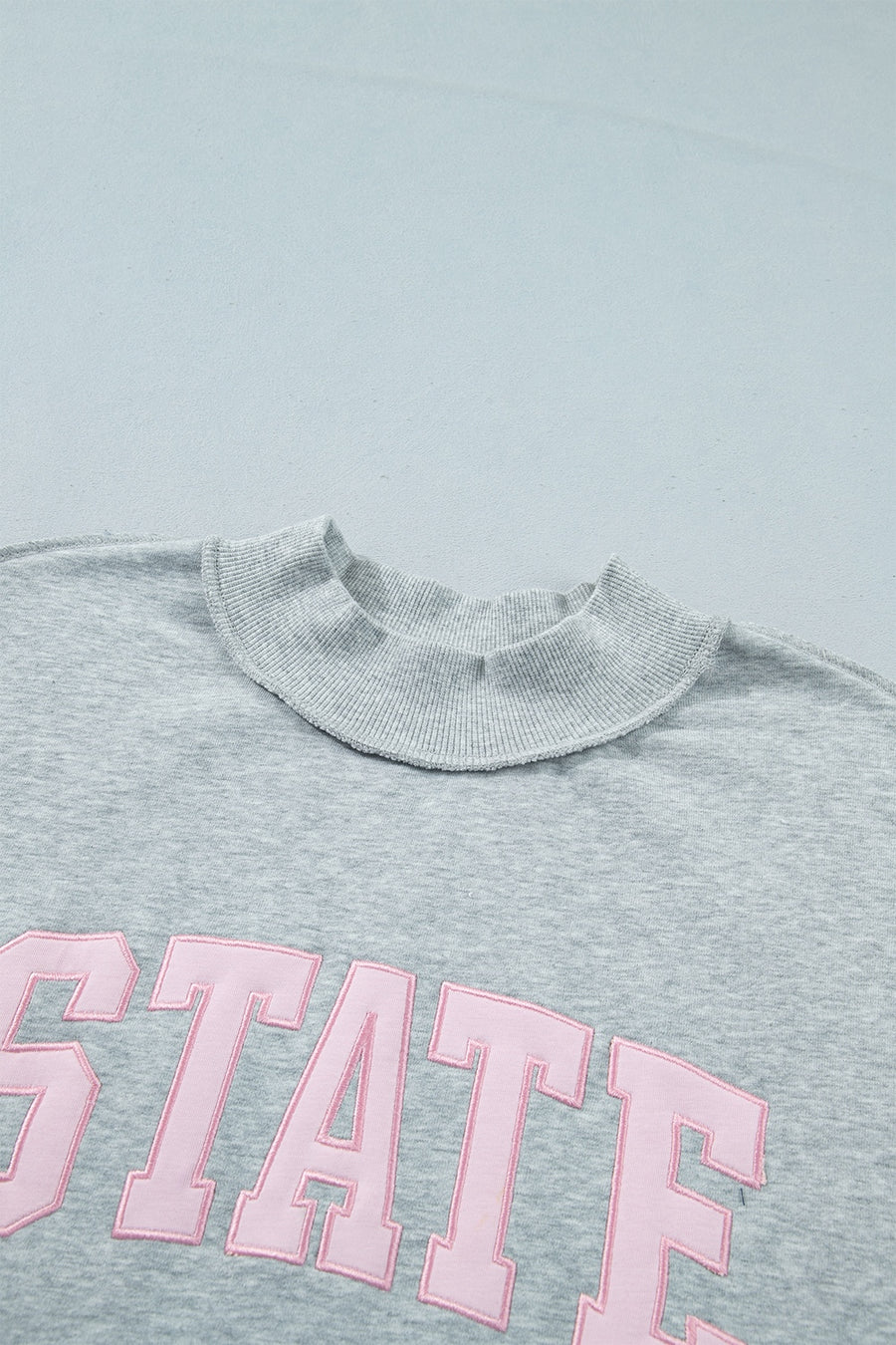 sweatshirt featuring graphic-print in light pink with 50% polyester, 50% cotton Care instructions: Machine wash cold texture