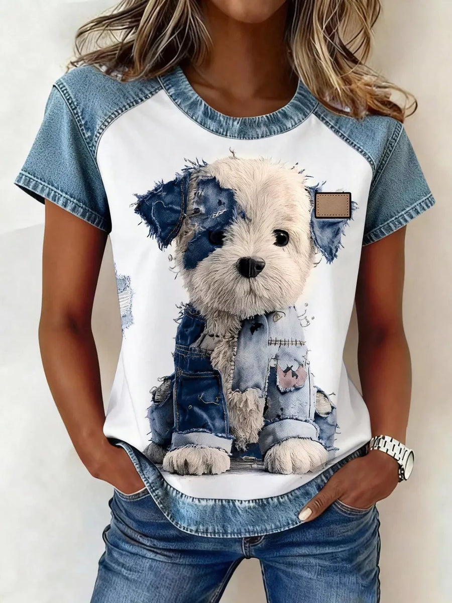 White t-shirt with denim patchwork sleeves and a distressed denim puppy graphic.