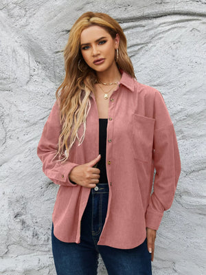 Pinkish corduroy button-up overshirt with chest pocket and relaxed fit.