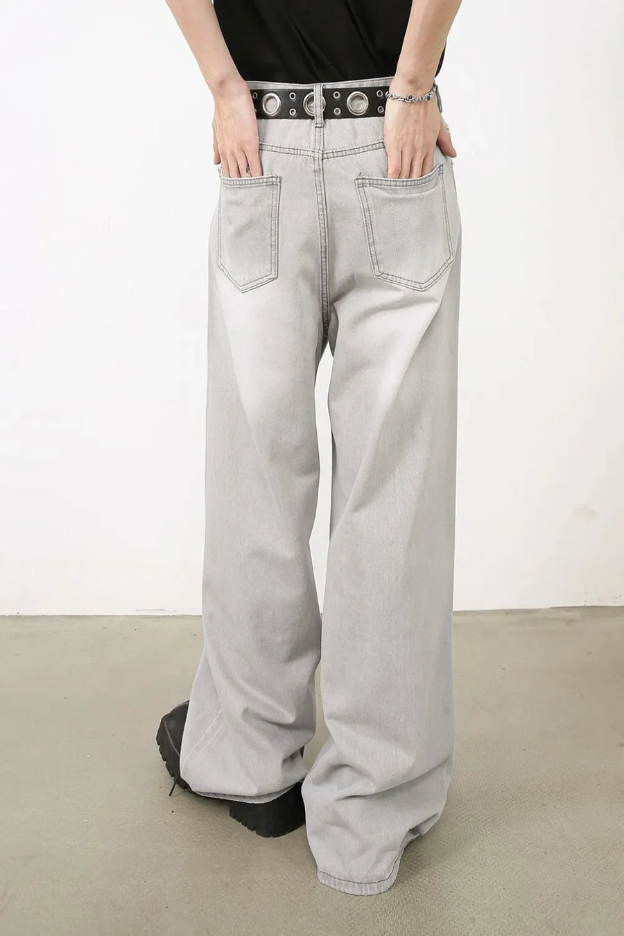 Bleached wash gray denim wide-leg trousers with a relaxed fit.