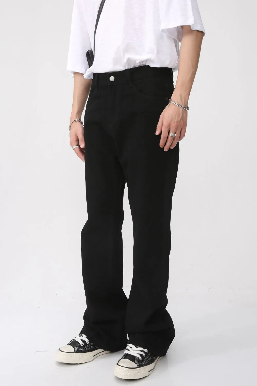 Black vintage wash flare denim trousers with a casual fit.