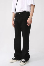 Black vintage wash flare denim trousers with a casual fit.