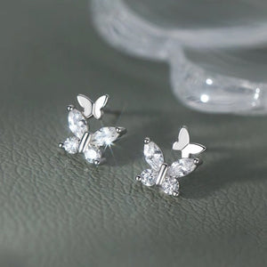 clear earrings featuring zircon embellishment and butterfly motif