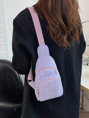 Lavender corduroy sling bag with zip pockets and pink strap