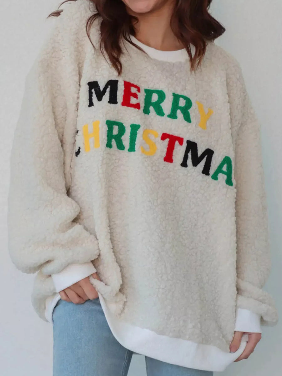 Cozy Christmas sherpa sweatshirt in beige with colorful embroidered "Merry Christmas" text.