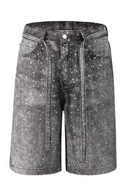 Embellished dark wash denim Bermuda shorts with rhinestone trim and scattered rhinestones.