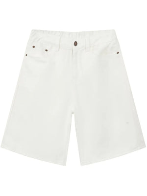 White denim bermuda shorts with a textured weave and button-fly closure.